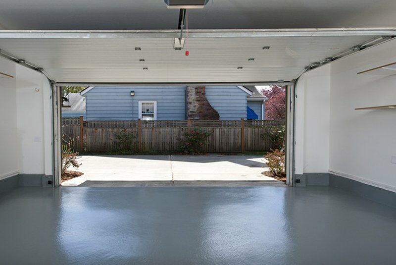 A garage door opened to show the outside.