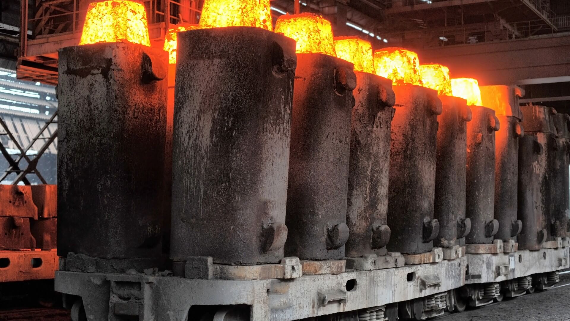 A bunch of steel cylinders are burning in the furnace.