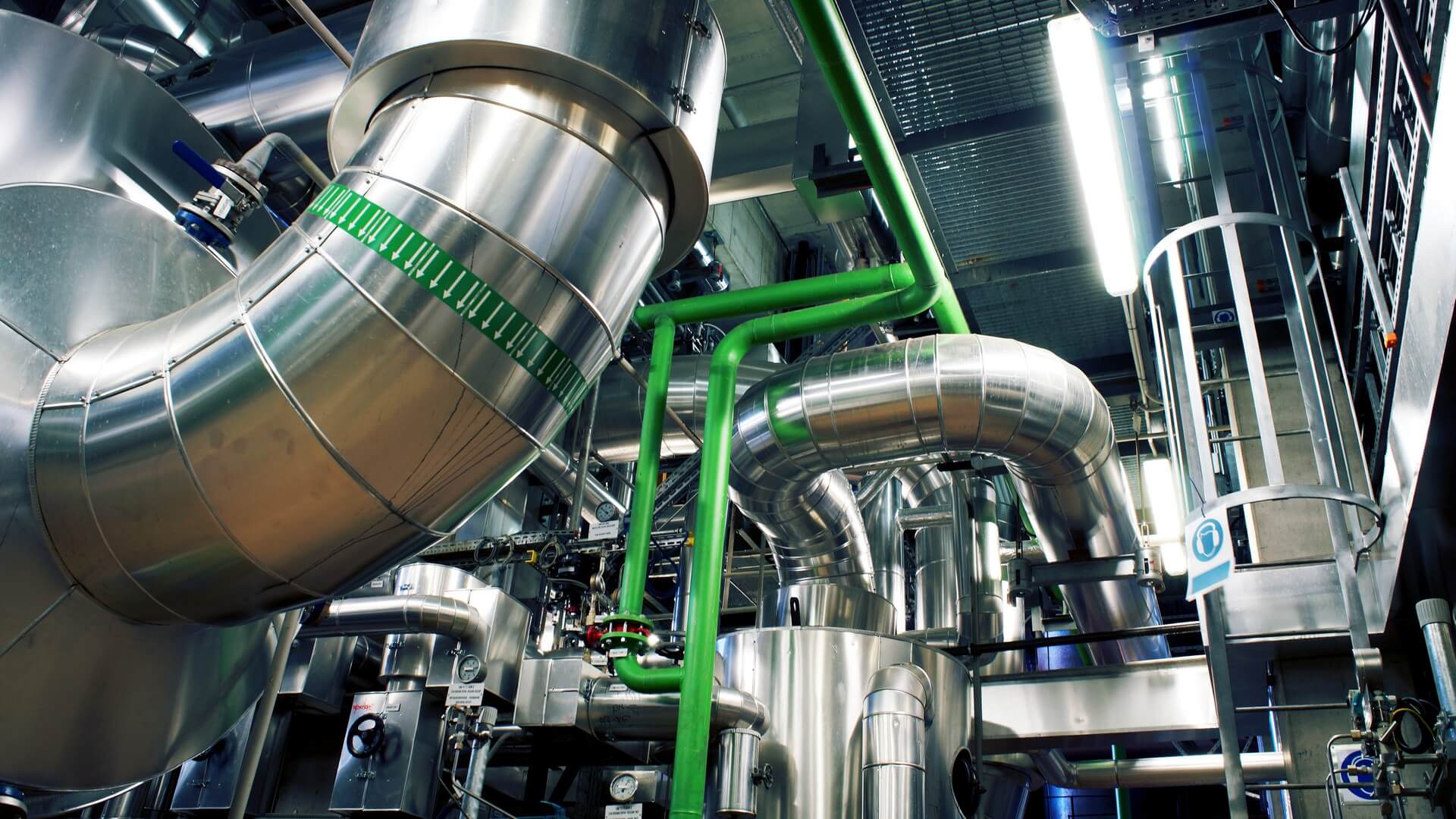 A large industrial plant with pipes and valves.