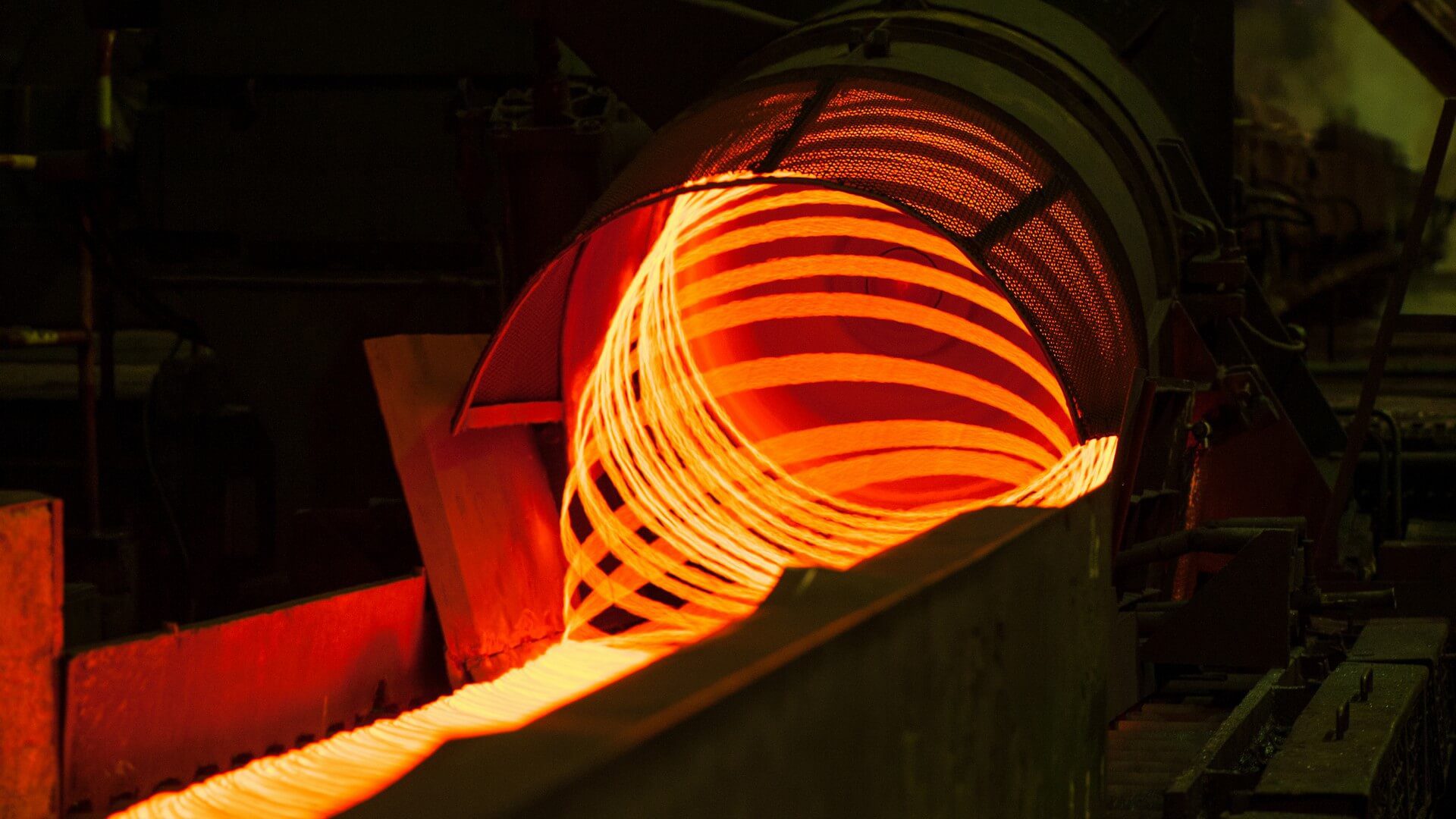 A metal coil is spinning in the dark.
