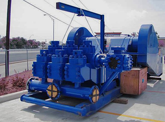 A blue machine is sitting on the ground.